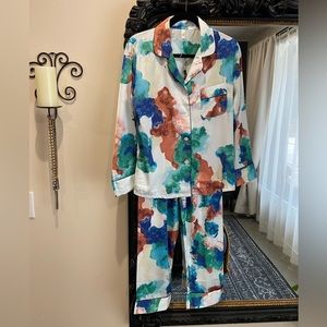 Two piece, satin, multi coloured outfit, with black piping.